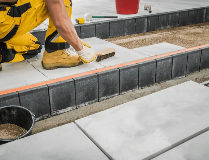 backyard-garden-concrete-bricks-paving-performed-by-professional-worker
