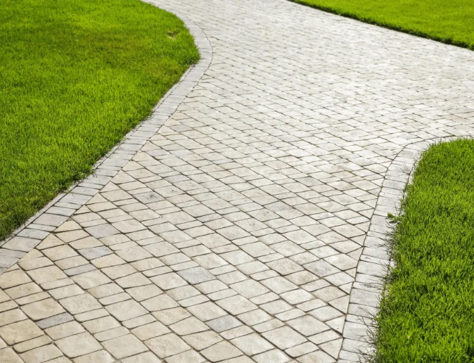 sidewalk-made-from-pavers-running-through-lawn